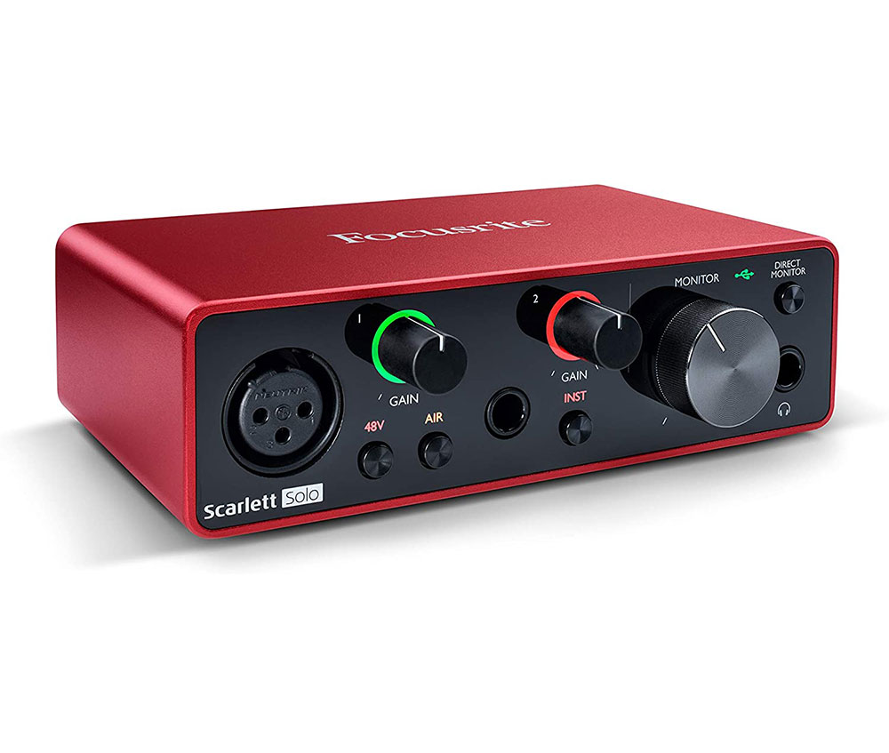Red audio interface with holes, knobs, buttons and lights